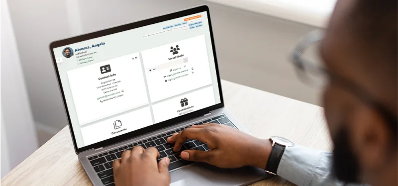 Man reviewing a donor's record in his MonkeyPod CRM